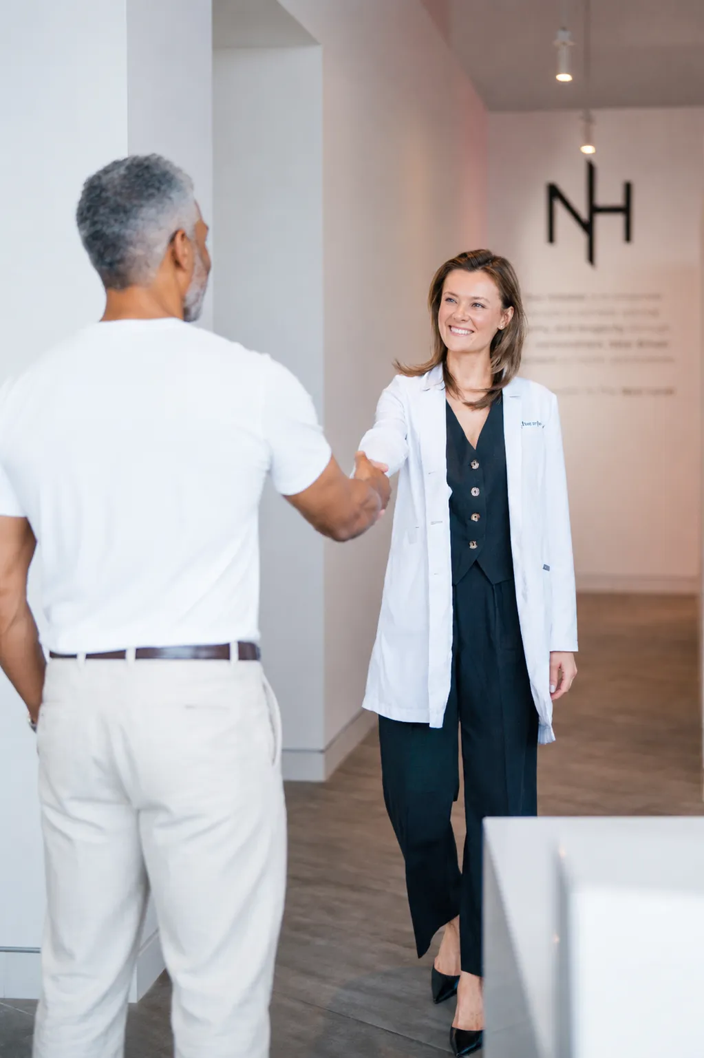 Physician greeting a partner practitioner in a Next Health clinic