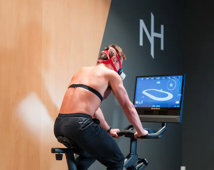 Client performing a VO2 max test on a stationary bike