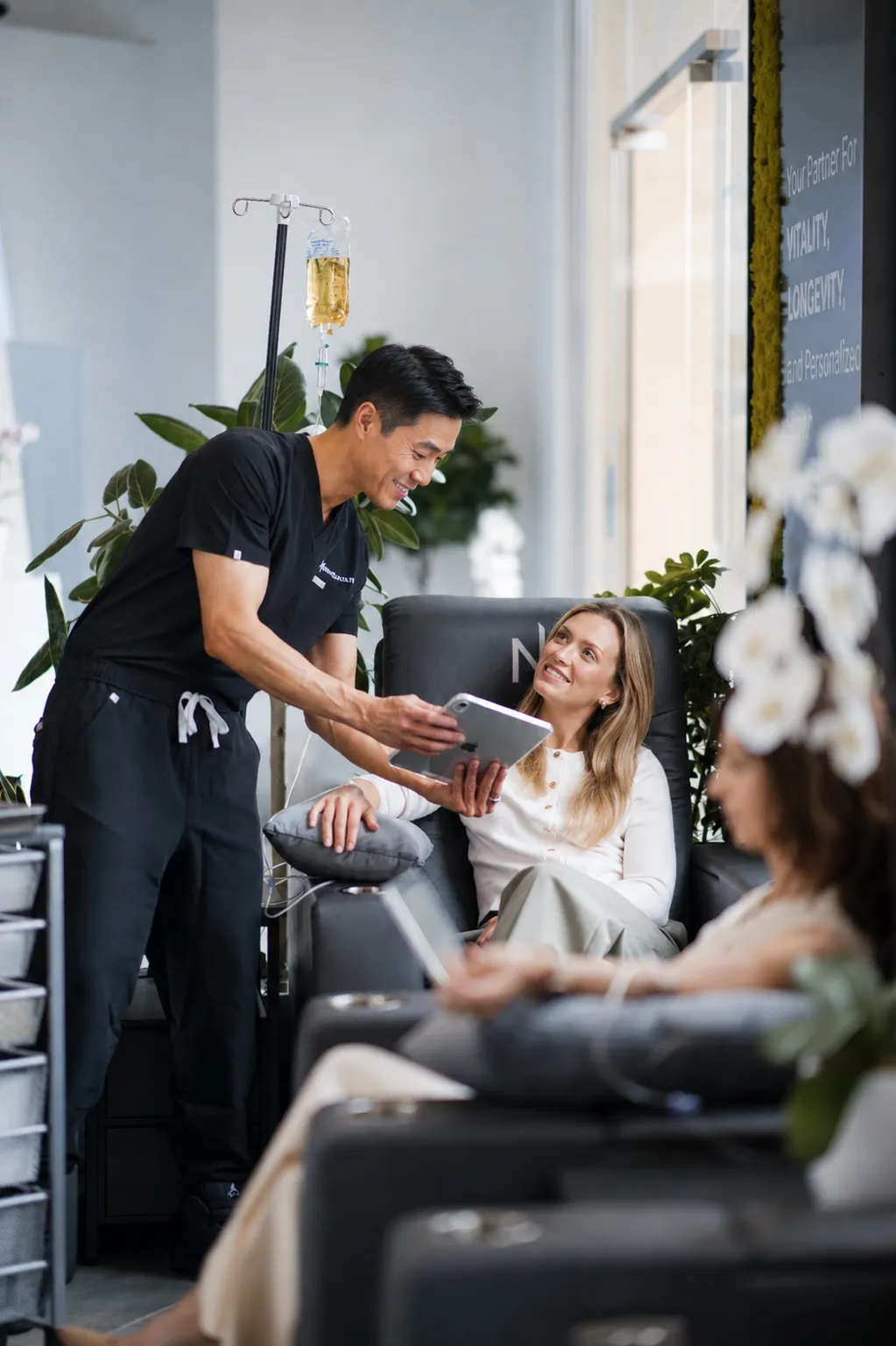 Next Health nurse reviewing results with a member during IV therapy